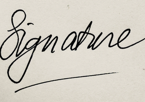 Handwritten signature on white paper